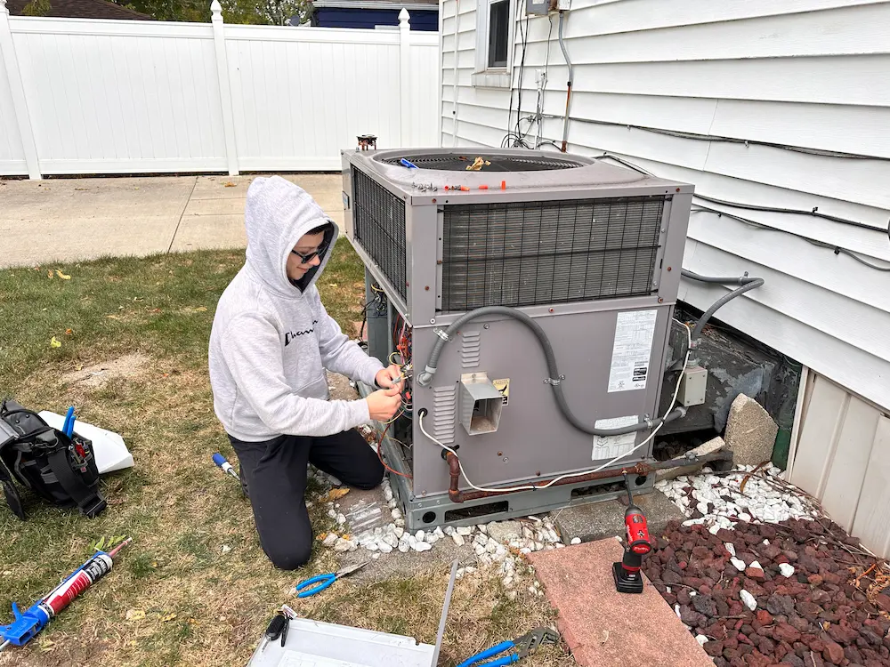 Service Pro Worker Fixing an AC