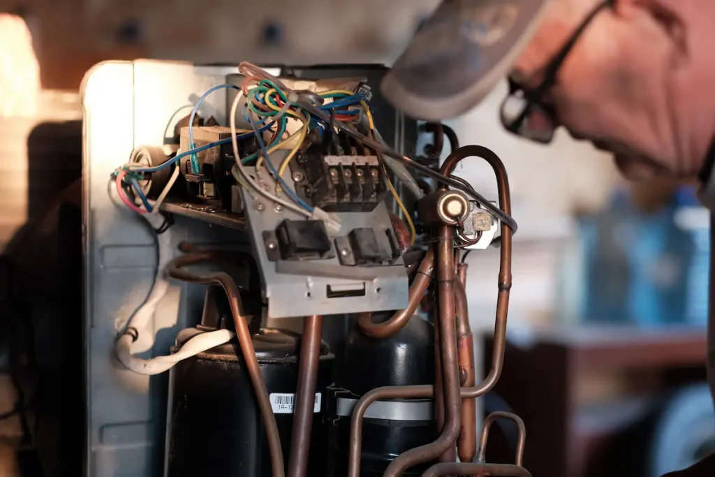 hvac worker performing a furnace maintenance Lincoln Park