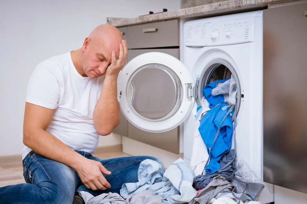 man worried about dryer machine that needs a new dryer vent installation